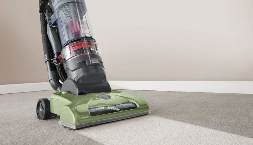 Commercial cleaning services California – vacuuming office carpet with professional-grade cleaner