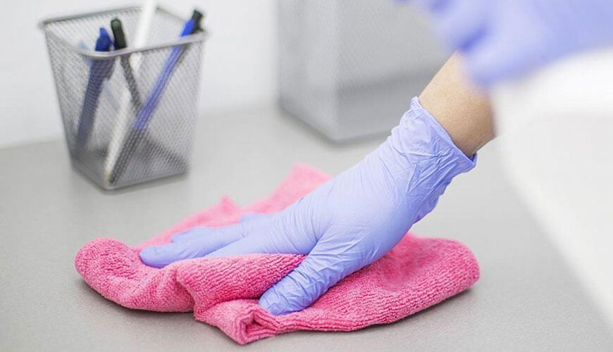 Residential cleaning services California – professional cleaner wiping desk